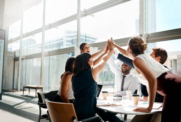 A group of people giving each other a high five

AI-generated content may be incorrect.